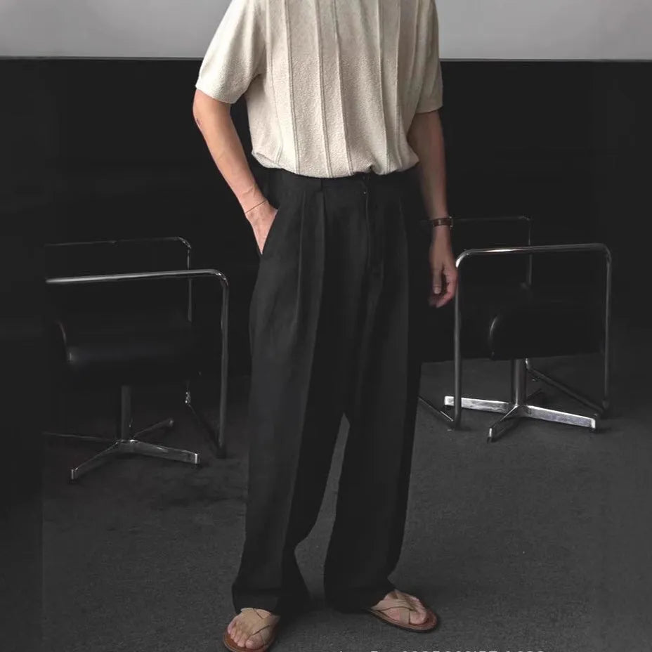 Men's apricot loose-fit cotton linen trousers with a pencil pants leg opening and micro-elastic waistband.