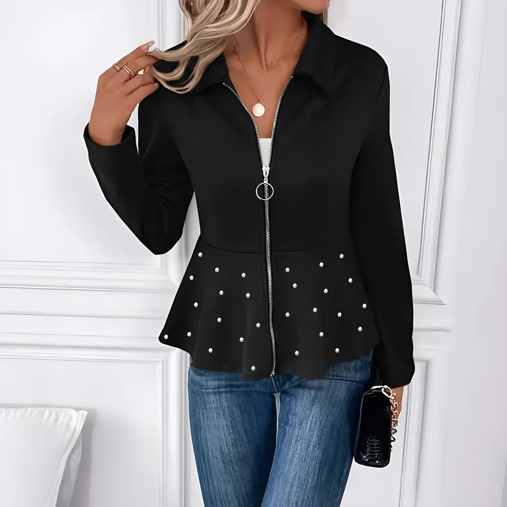 Women's black loose fit coat with a ruffled hem and a heavy-duty front zipper.