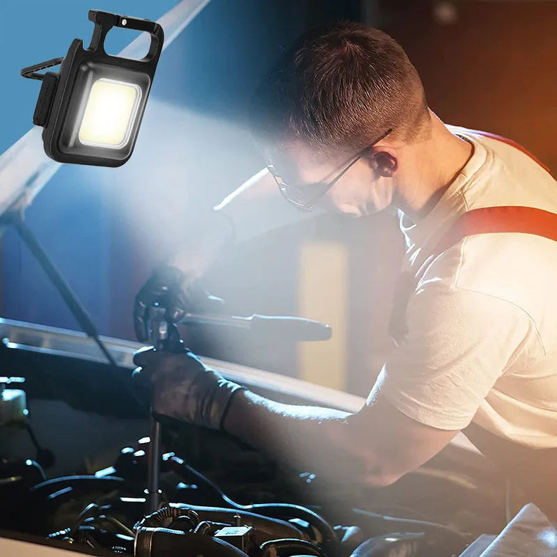 Black aluminium alloy USB rechargeable keychain flashlight with magnetic base and foldable handle