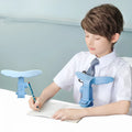 Student anti-myopia seated posture orthosis in blue silicone and ABS on a desk