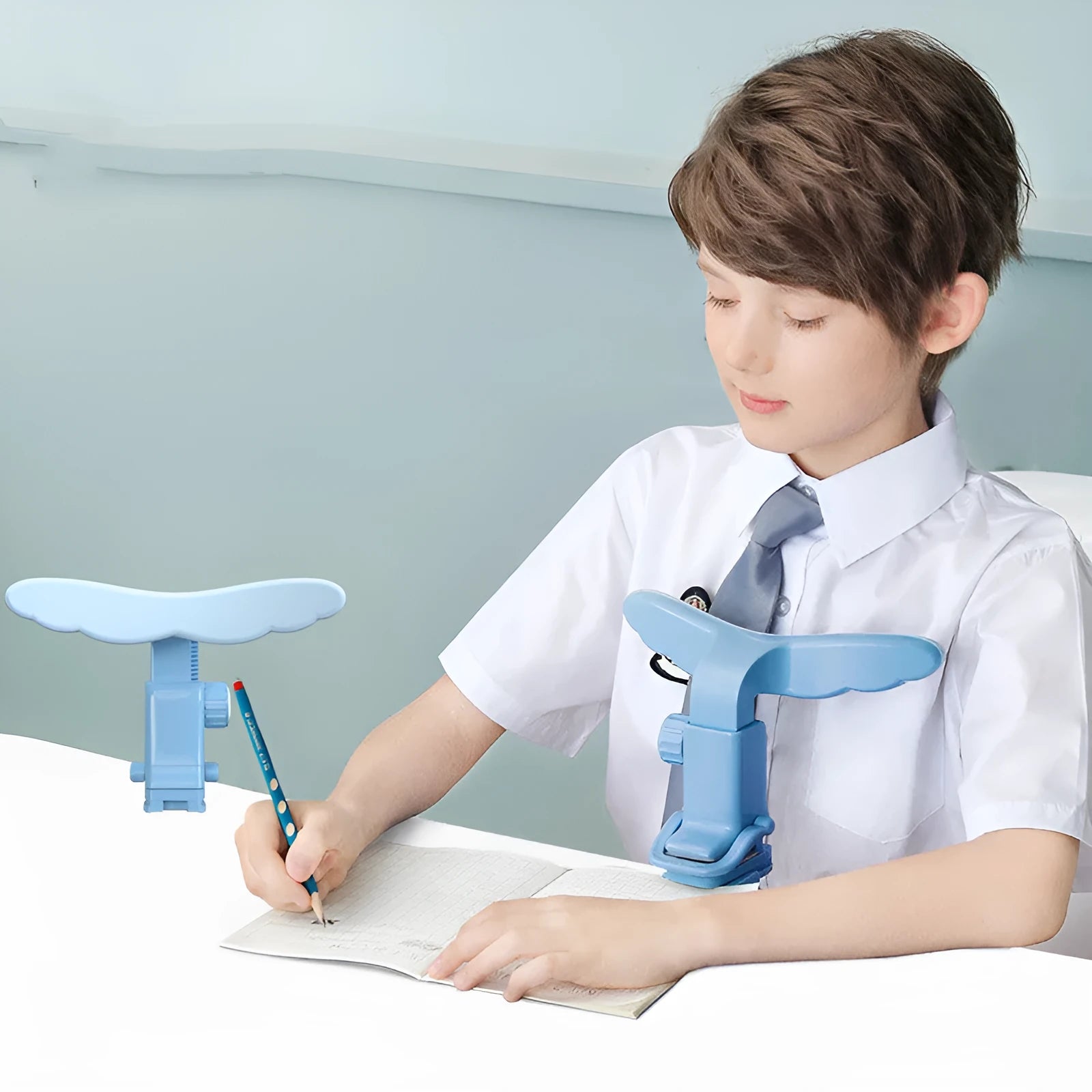 Student anti-myopia seated posture orthosis in blue silicone and ABS on a desk
