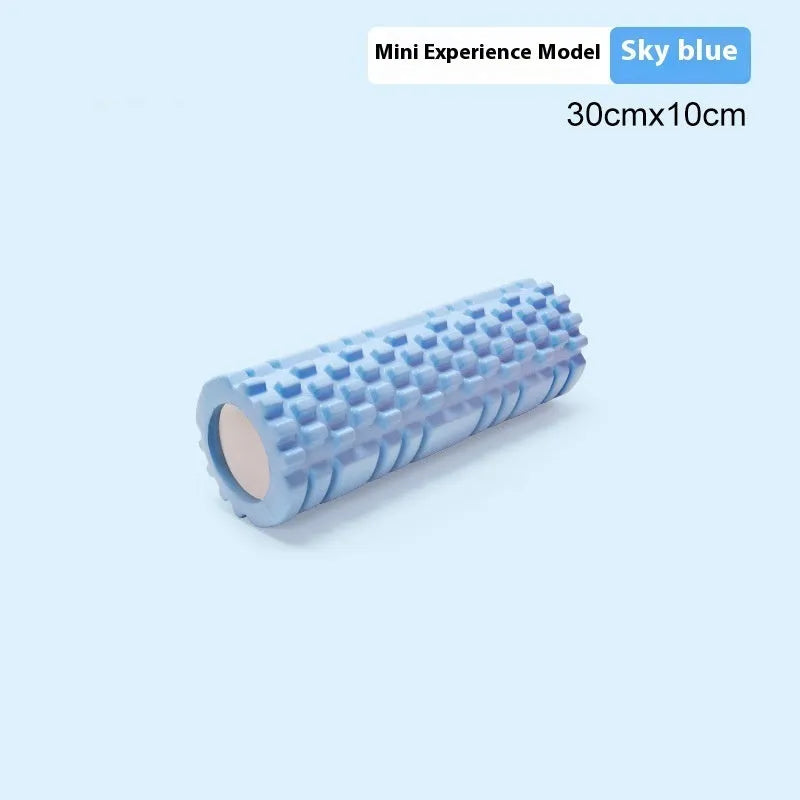 EVA foam roller for fitness in black, shown on a wooden floor.