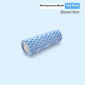EVA foam roller for fitness in black, shown on a wooden floor.