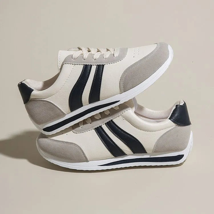Low top lace-up running sneakers in red or blue with mesh upper and rubber sole