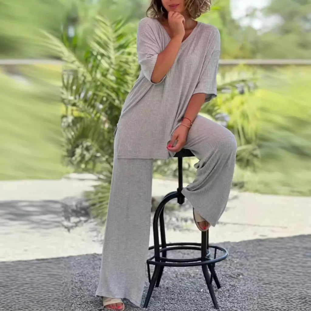 Women's two-piece knitwear set with long sleeve top and baggy straight trousers in black, grey, or beige, sizes S to 3XL