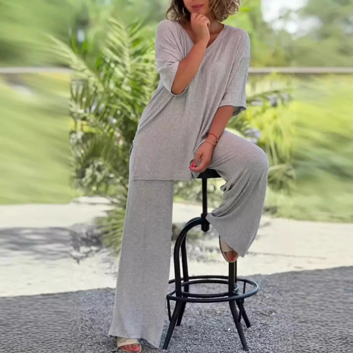 Women's two-piece knitwear set with long sleeve top and baggy straight trousers in black, grey, or beige, sizes S to 3XL