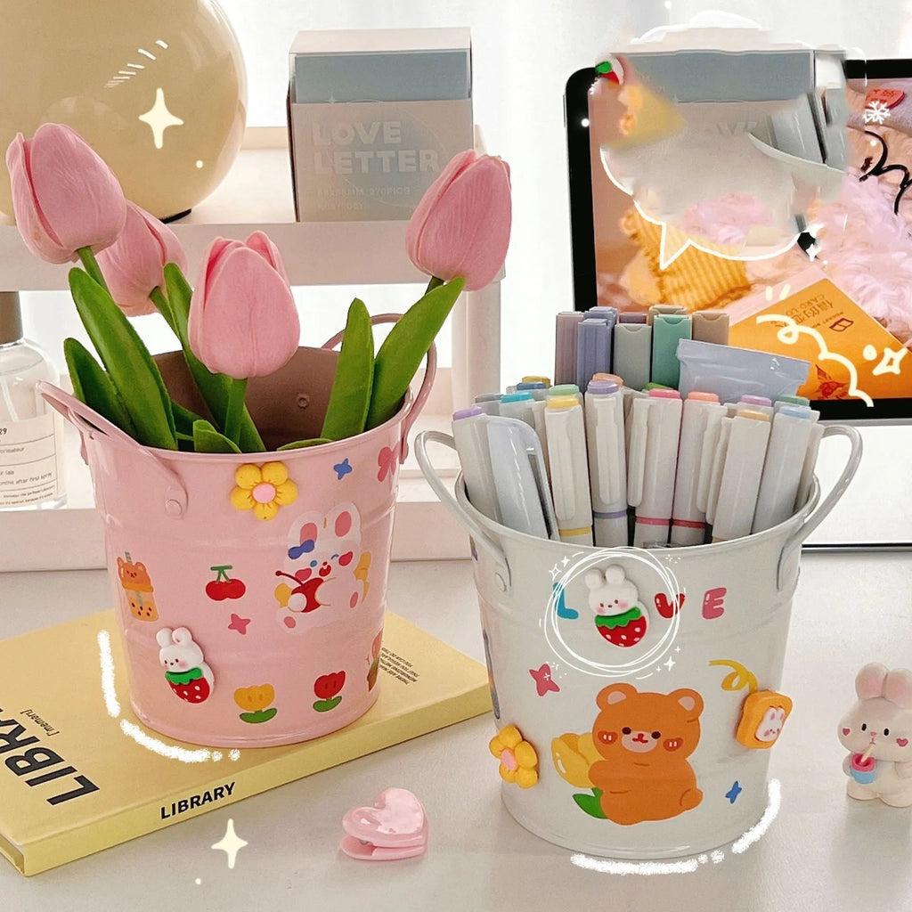Round metal desktop pen holder in a choice of colours including green, pink, red, white, and yellow.