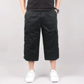 Man wearing loose khaki cotton cropped casual pants suitable for sports.