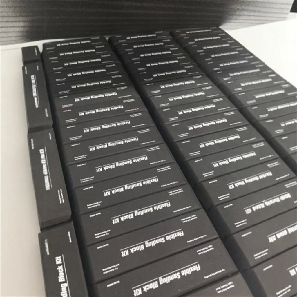 Seven black EVA frosted metal blocks arranged as a set