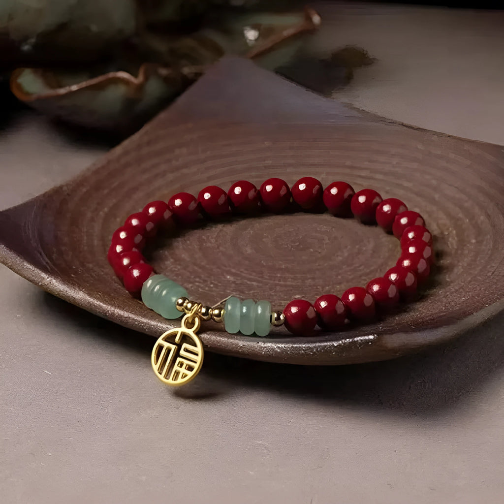 Handcrafted gold cinnabar bracelet with wave design in pumpkin cinnabar colour