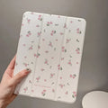 Transparent floral tri-fold iPad case with magnetic kickstand open in viewing position