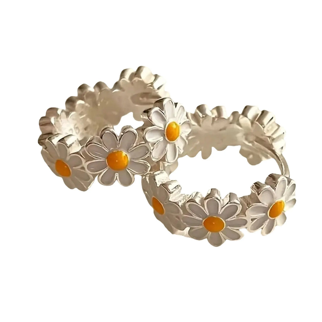 White daisy flower ring earrings with platinum gemstone accents on copper base