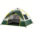 Dark green automatic quick-open camping tent for 3-4 people set up in an outdoor field.