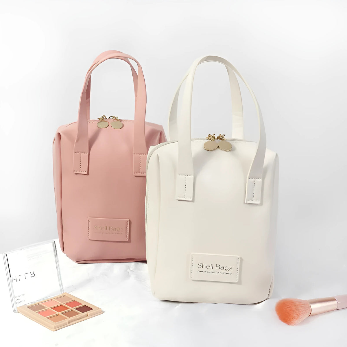 Girly heart egg shell waterproof makeup bag in solid pink with sewing line detail, 15x8x18cm, open to show PU lining