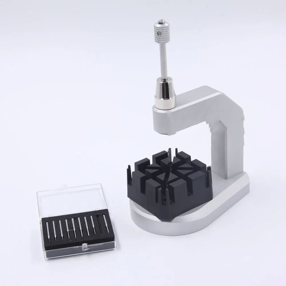 Silver-coloured press strap removal tool for watch and electronics repair.