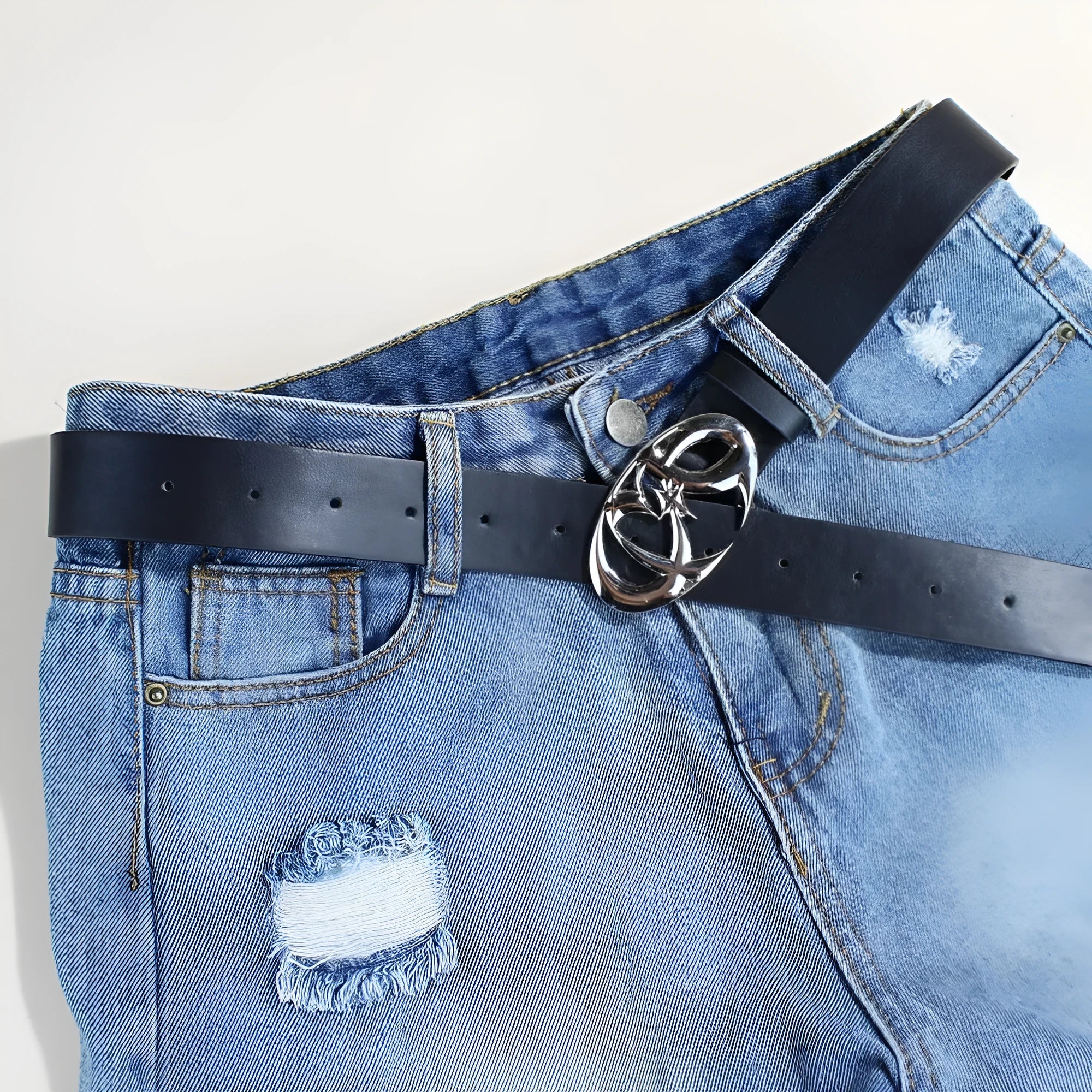 Casual silver buckle belt made from PU leather with snap button fastening