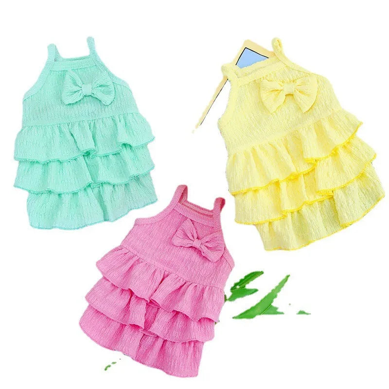 Small dog wearing princess dress with layered skirt in rose red, yellow or green
