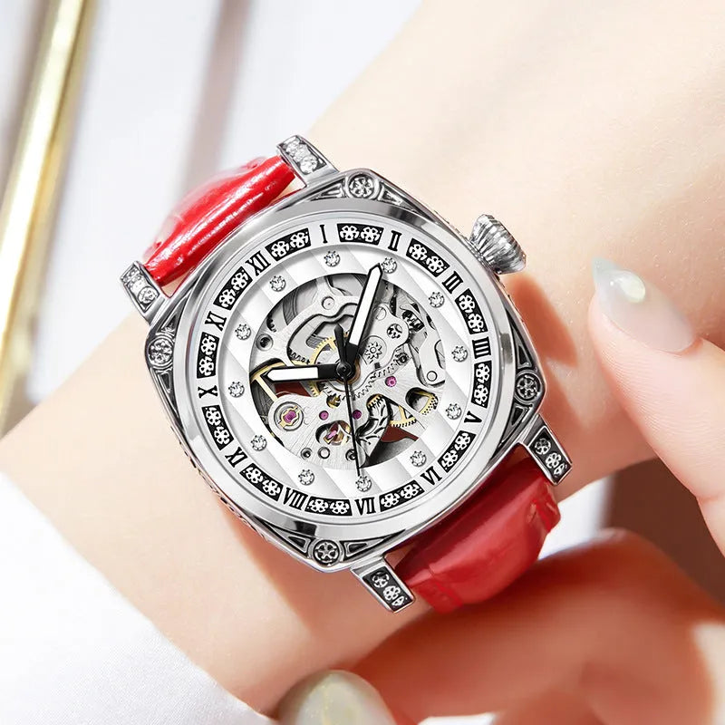 Mechanical watch with luminous hands and a black leather strap, showing 10m water resistance.
