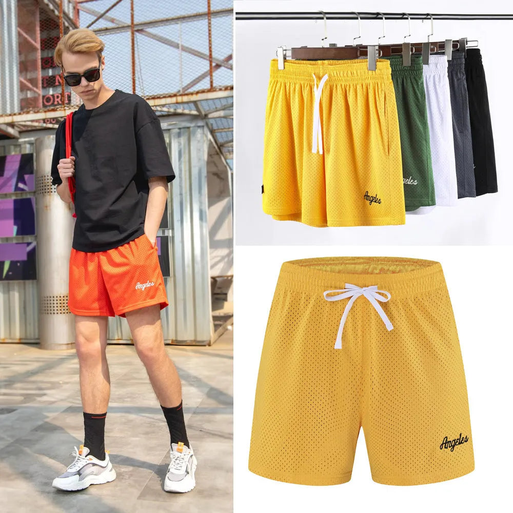 Men's double-layer mesh sports shorts in black polyester fabric showing side profile with elastic waistband