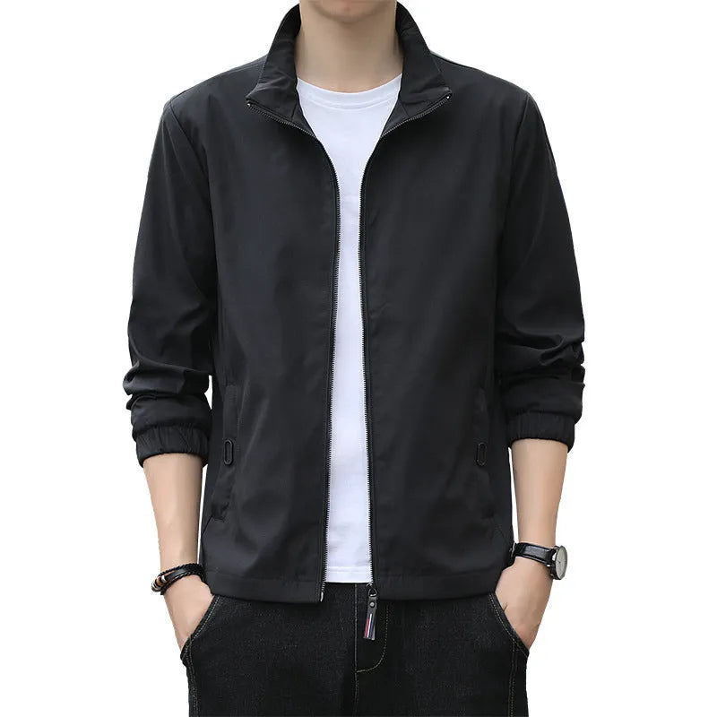 Man wearing a loose-fit Korean style casual jacket in blue, with zip-up front and pocket detail.