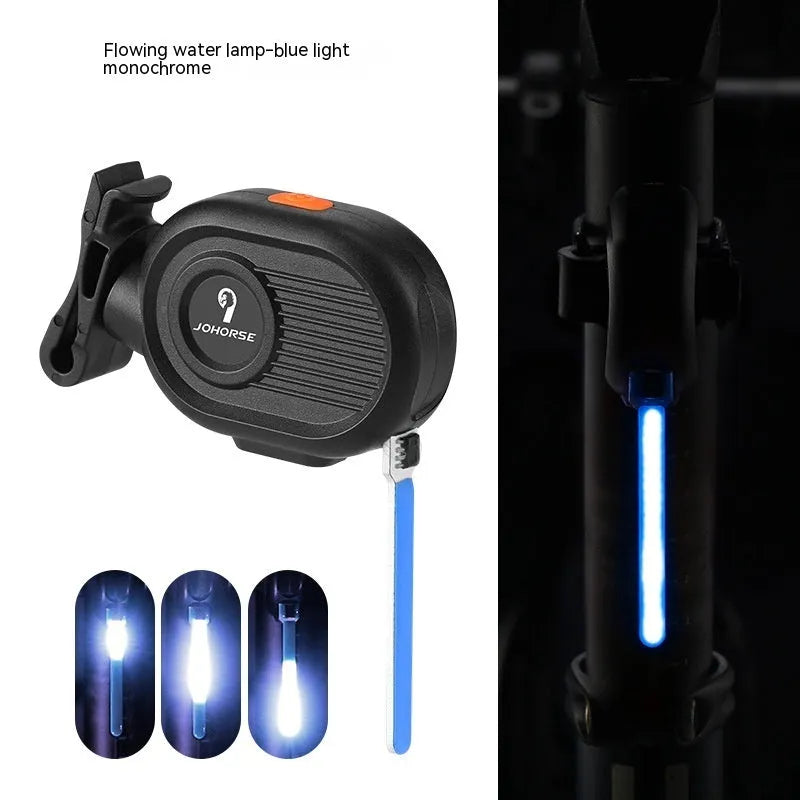 Bicycle tail light with colourful running water LED effect mounted on a bike seat post.