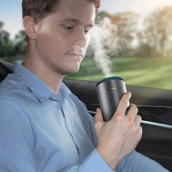 Dark gray column-shaped mini USB aromatherapy humidifier with 5W power and 0.5-1L reservoir for car and small room use