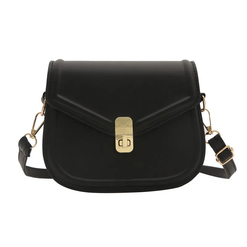 Soft PU leather clamshell shoulder messenger bag in horizontal square shape on adjustable strap.