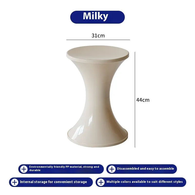 Hourglass-shaped plastic shoe changing stool in a choice of five colours: black, green, red, white, brown.