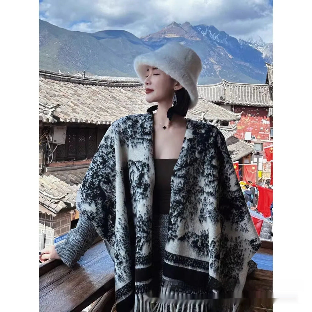 Women's polyester tassel scarf cape in a shawl style, shown in available colours.