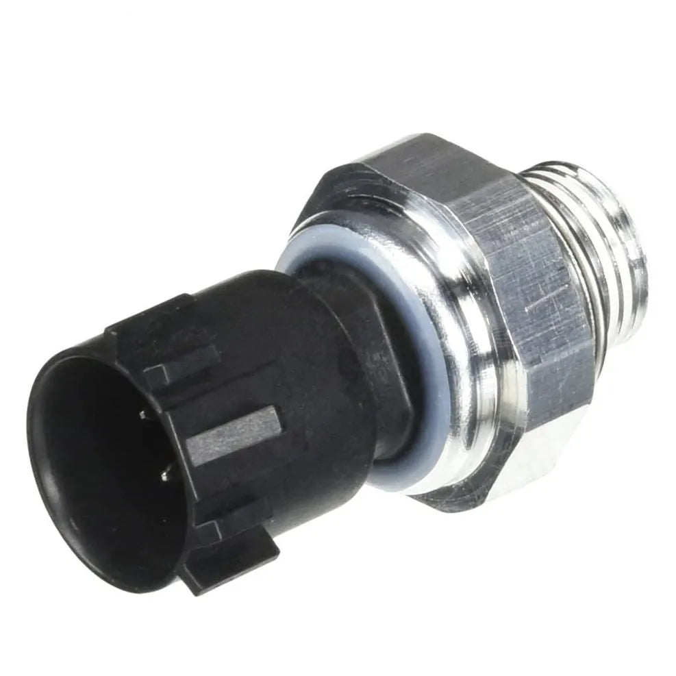Silver automobile fuel pressure sensor replacement part on white background.