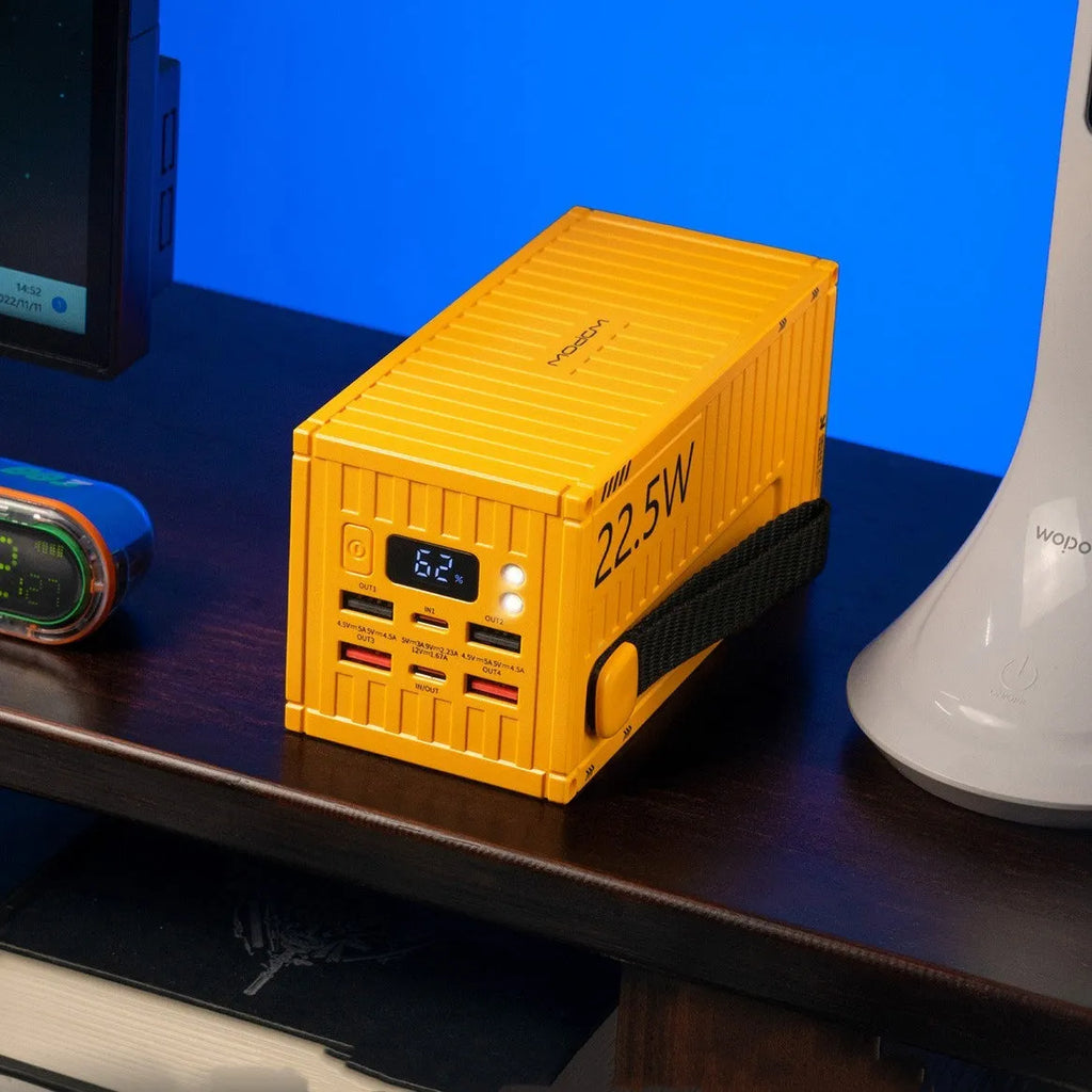 Large yellow 50000mAh power bank showing a digital display and five USB output ports