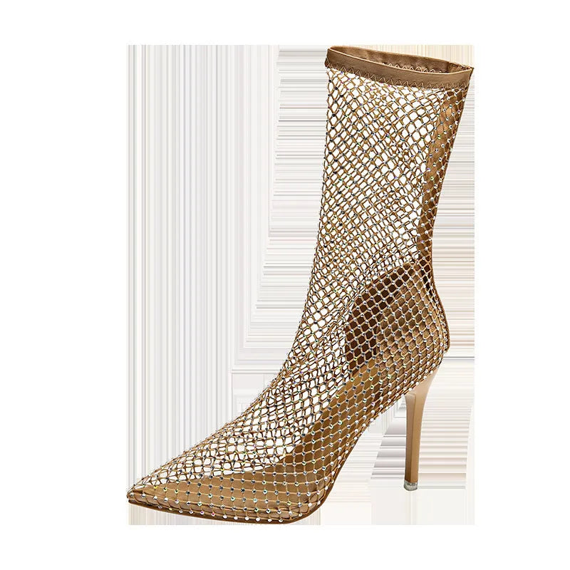 Gold mesh high heel sandals with a pointed toe and stiletto heel on a rubber sole.