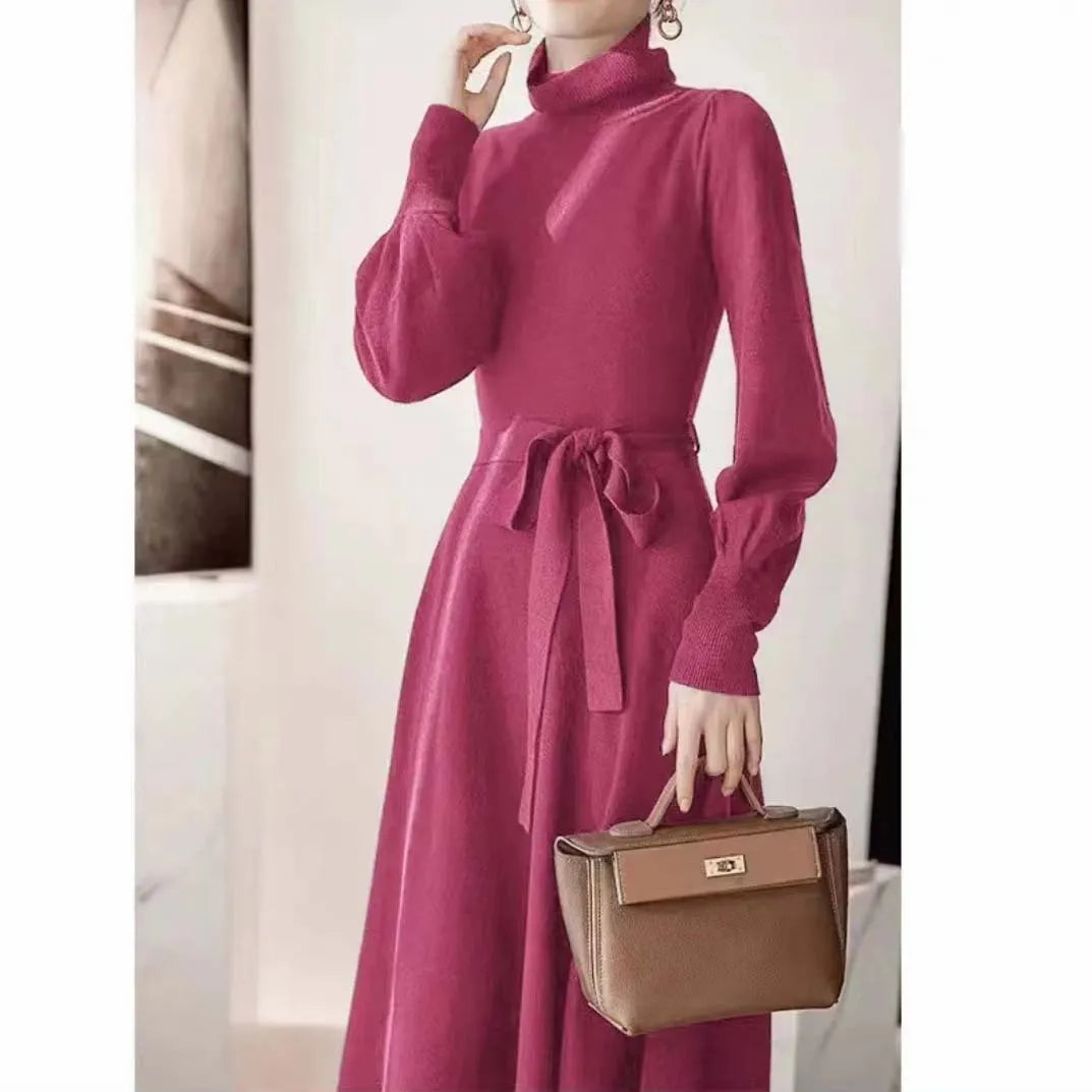 Rose red loose fit turtleneck knitted dress with long sleeves and a midi-length skirt.