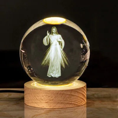 6cm white crystal religious ornament on wooden base with warm lighting