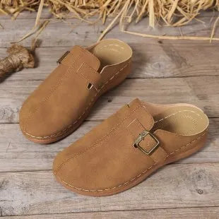 Women's casual wedge slippers in various colours with a cloth upper and rubber sole.