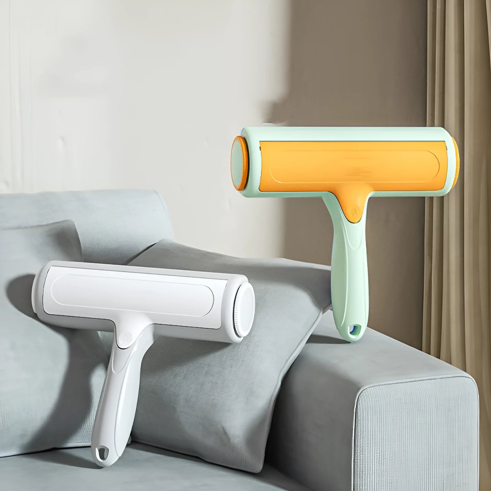 Two-way roller pet hair removal brush in green orange colour with ABS body and nylon fibre bristles on a beige sofa