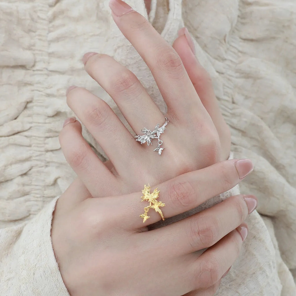 Adjustable silver ring with a detailed butterfly design in a choice of white gold or gold colour finish.