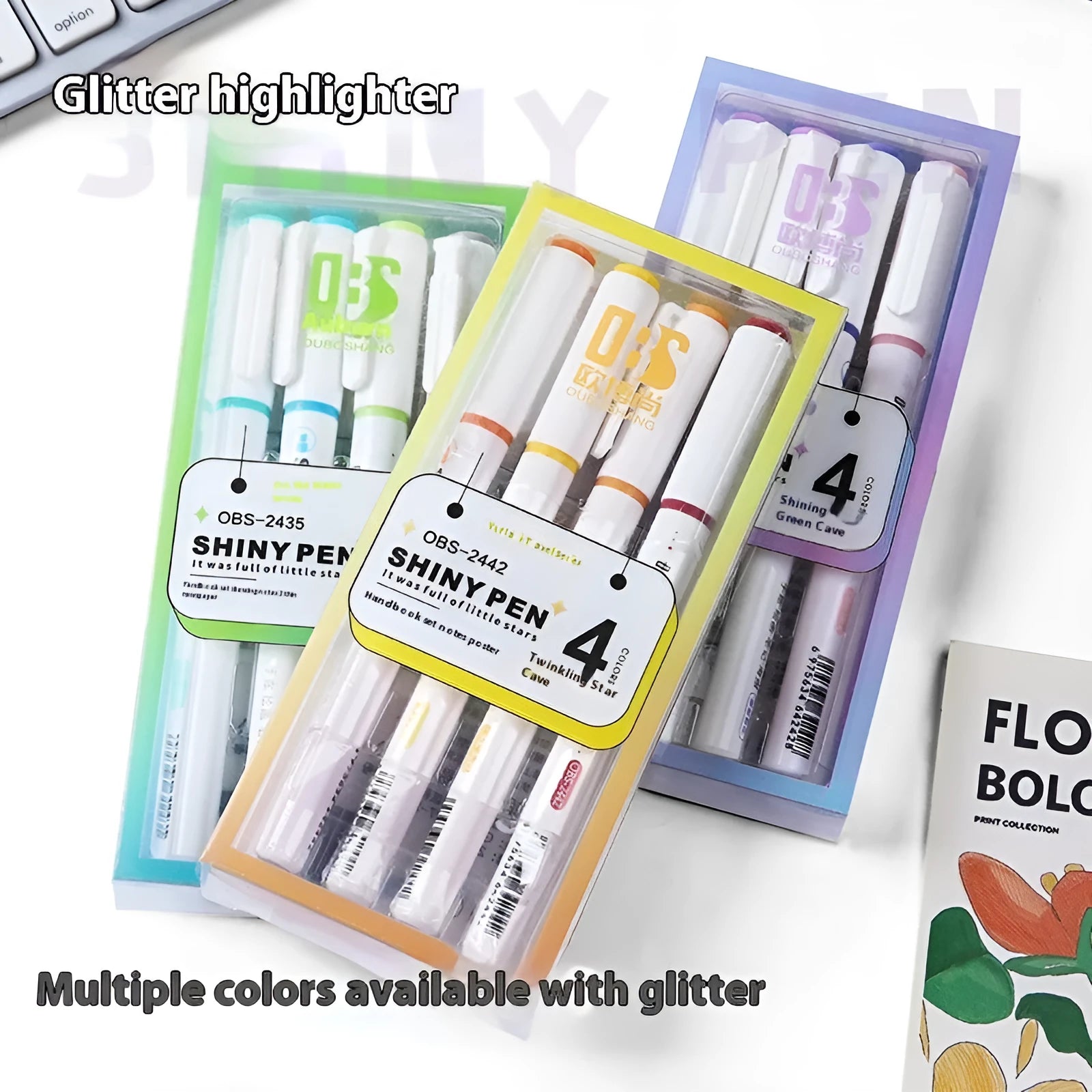 Set of four glitter fluorescent highlighter pens with pastel colours in a star river design box.