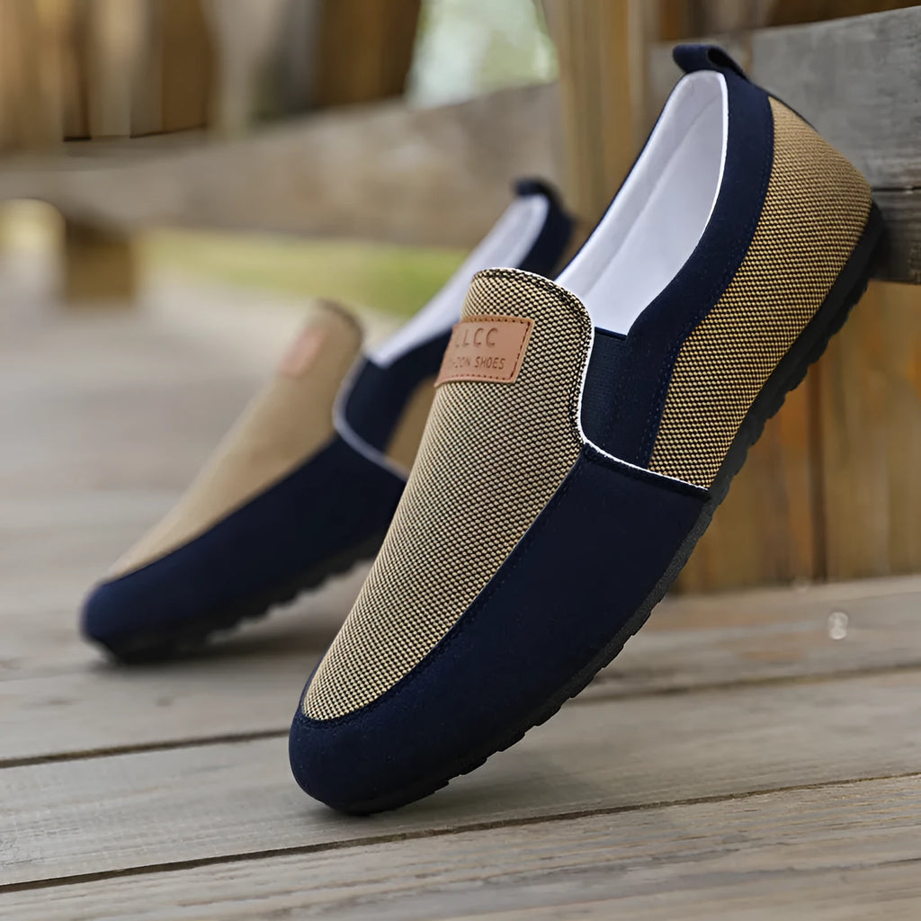 Men's grey canvas board shoes with round toe and rubber sole on a white background.