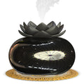 Pure black round USB aromatherapy humidifier with ultrasonic mist outlet.