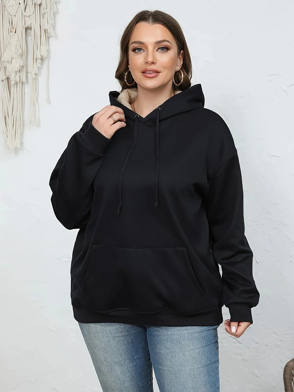Women's black hooded sweater with 3D pattern design and front pockets