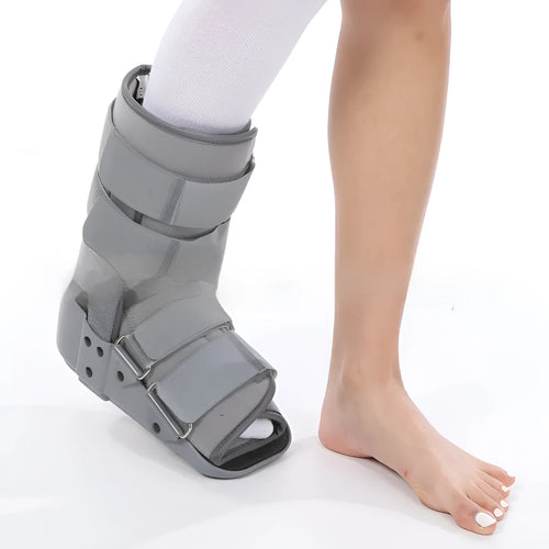 Grey and black Achilles tendon rehabilitation boot with plastic shell, adjustable straps, and rubber sole.
