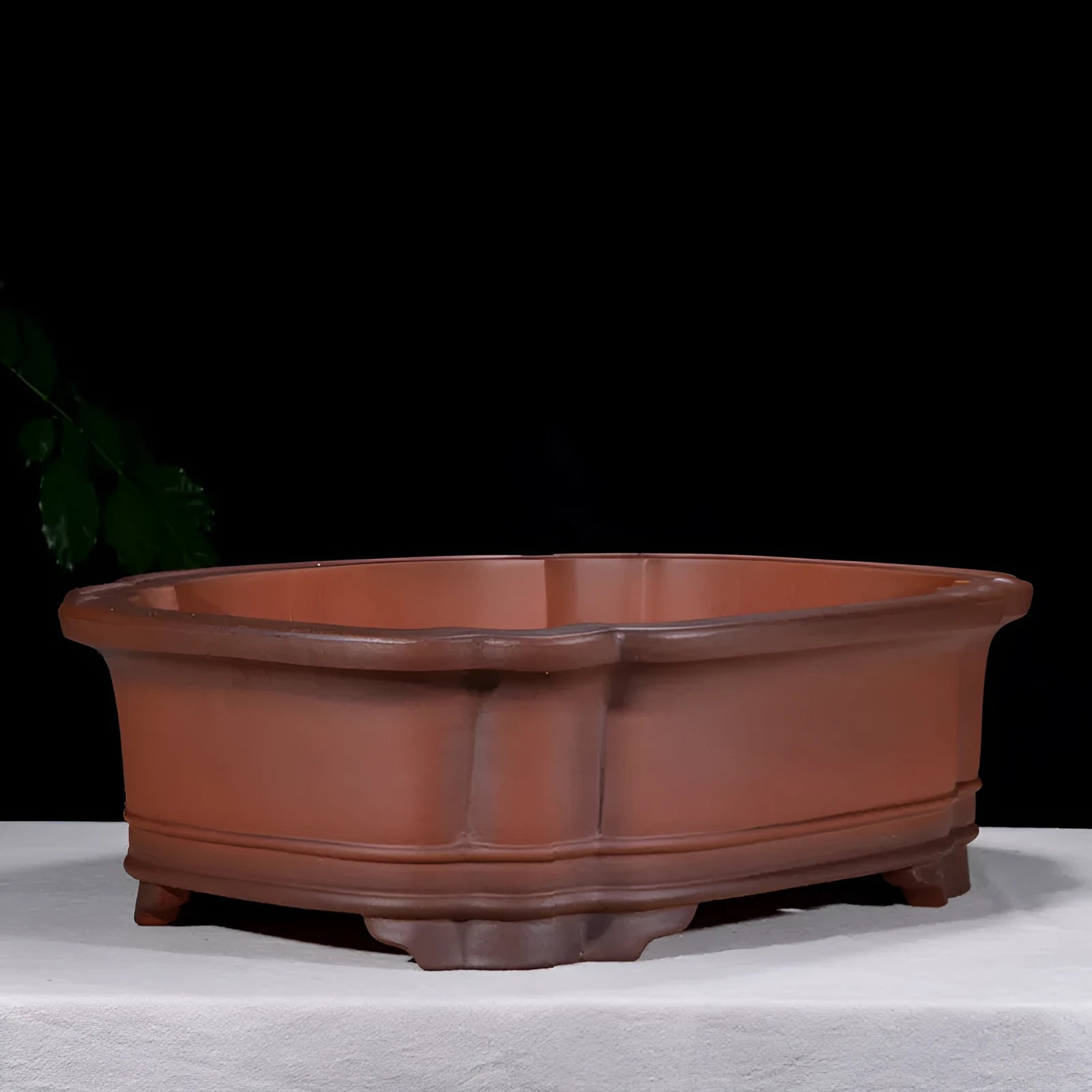 Large antique-finish purple clay Chinese style garden flower pot showing its size and deep planting cavity.