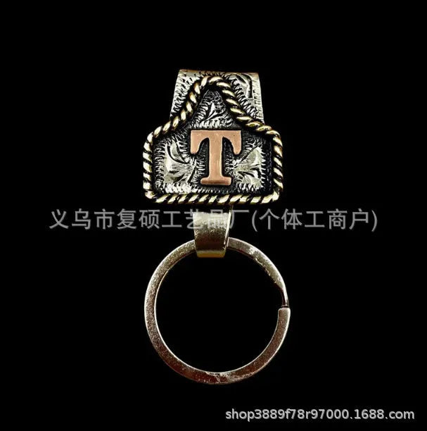 Handmade metal cow tag belt keychain in rustic design with multiple colour options
