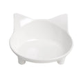 Shallow white melamine cat bowl with non-slip rubber base on a floor