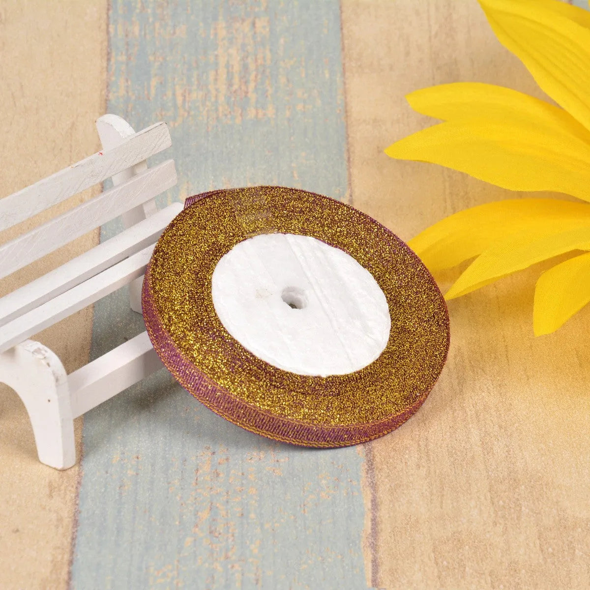 A roll of colourful green onion pattern polyester ribbon with metallic wire highlights, shown at 3-points width.