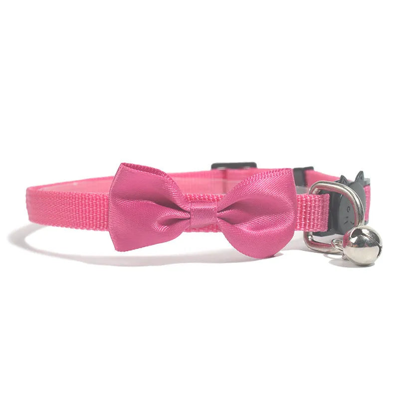 Adjustable nylon cat bow collar with a bell in a striped pattern, shown in a bright colour.