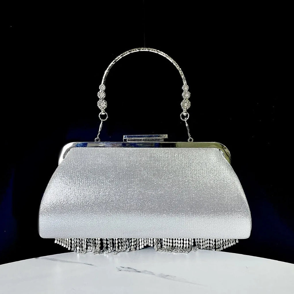 Tassel banquet bag in silver, gold or black polyester with shell shape and chain detail