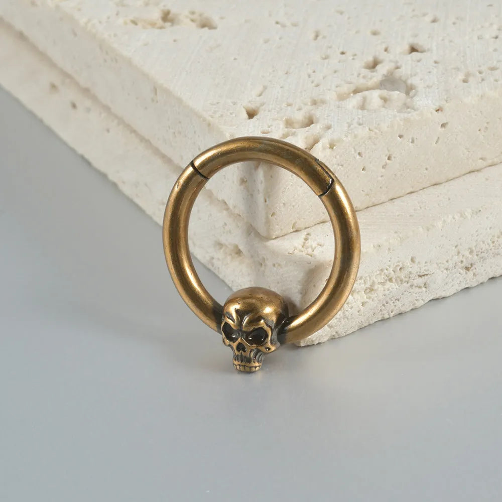 Copper punk earrings with ghost head designs in antique gold or silver finishes