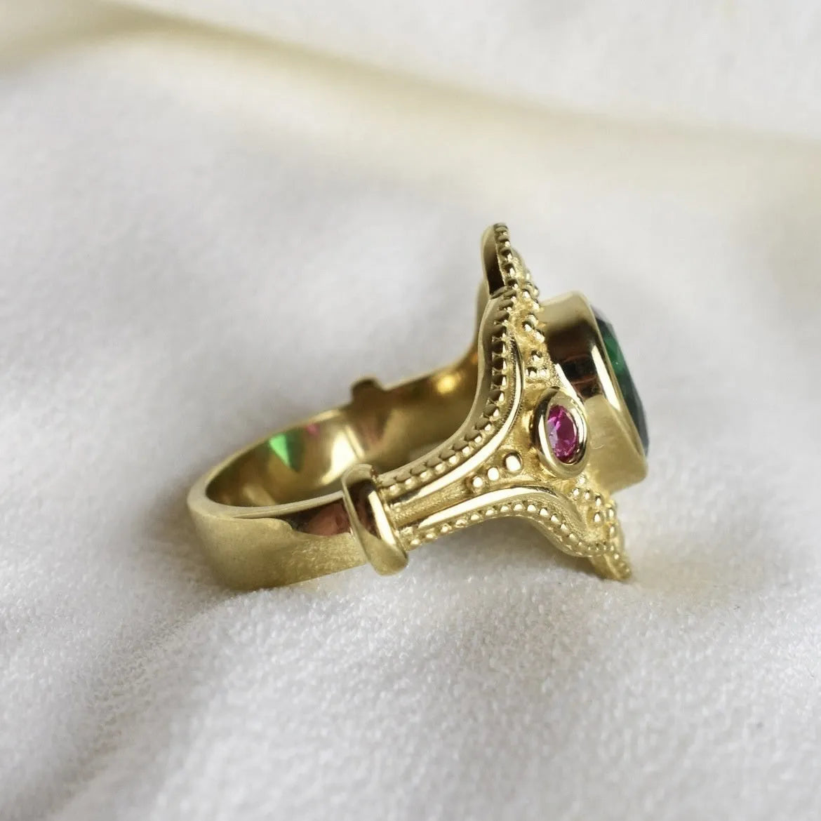 Gold geometric women's ring on display showing alloy construction with electroplated finish